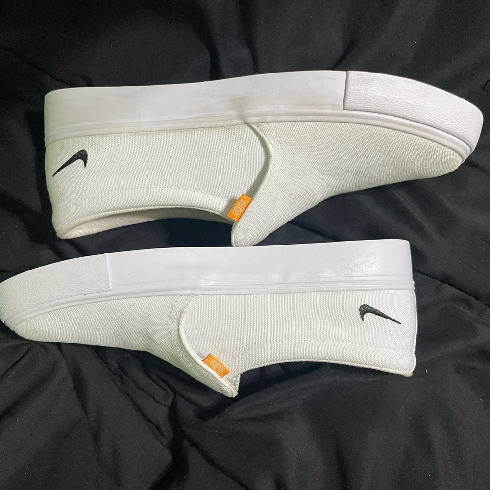 White Nike slip ons